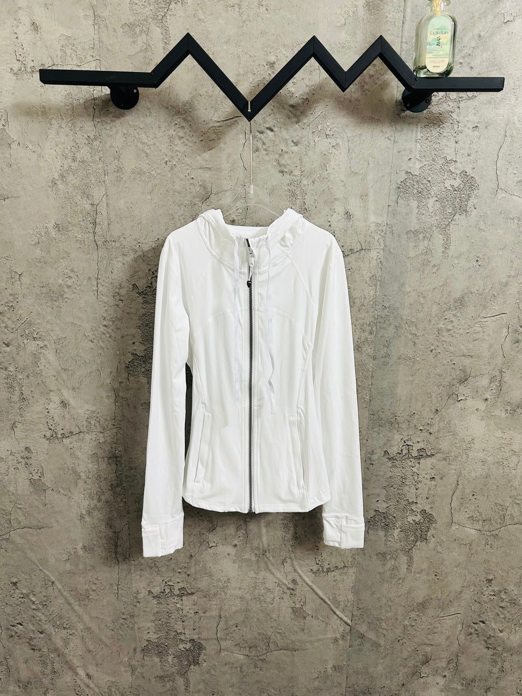 White zip-up hooded jacket, full front zipper and standing collar