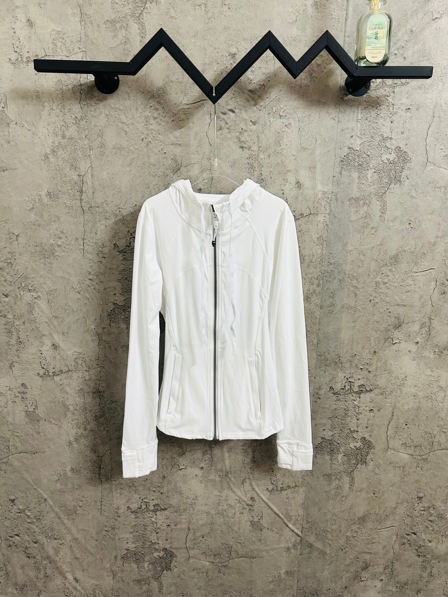 White zip-up hooded jacket, full front zipper and standing collar