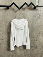 White hooded jacket worn with hood down, full front zip and long sleeves