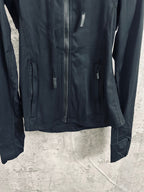 Dark hooded zip jacket with chest zipper and side pockets