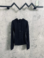 Dark hooded zip jacket with drawstring at hood