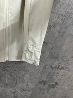 Light cream ribbed jacket with cuffed hem and side seam detail
