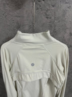 Light cream ribbed high-neck jacket with curved yoke seam and small chest logo