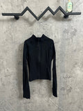 Dark zip-up jacket with stand collar, cropped length, long sleeves