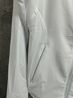 White jacket side panel with zipper and drawcord accents