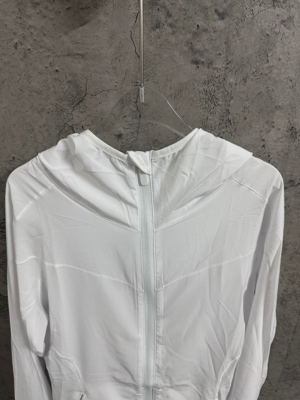 White hooded zip jacket front view with high collar