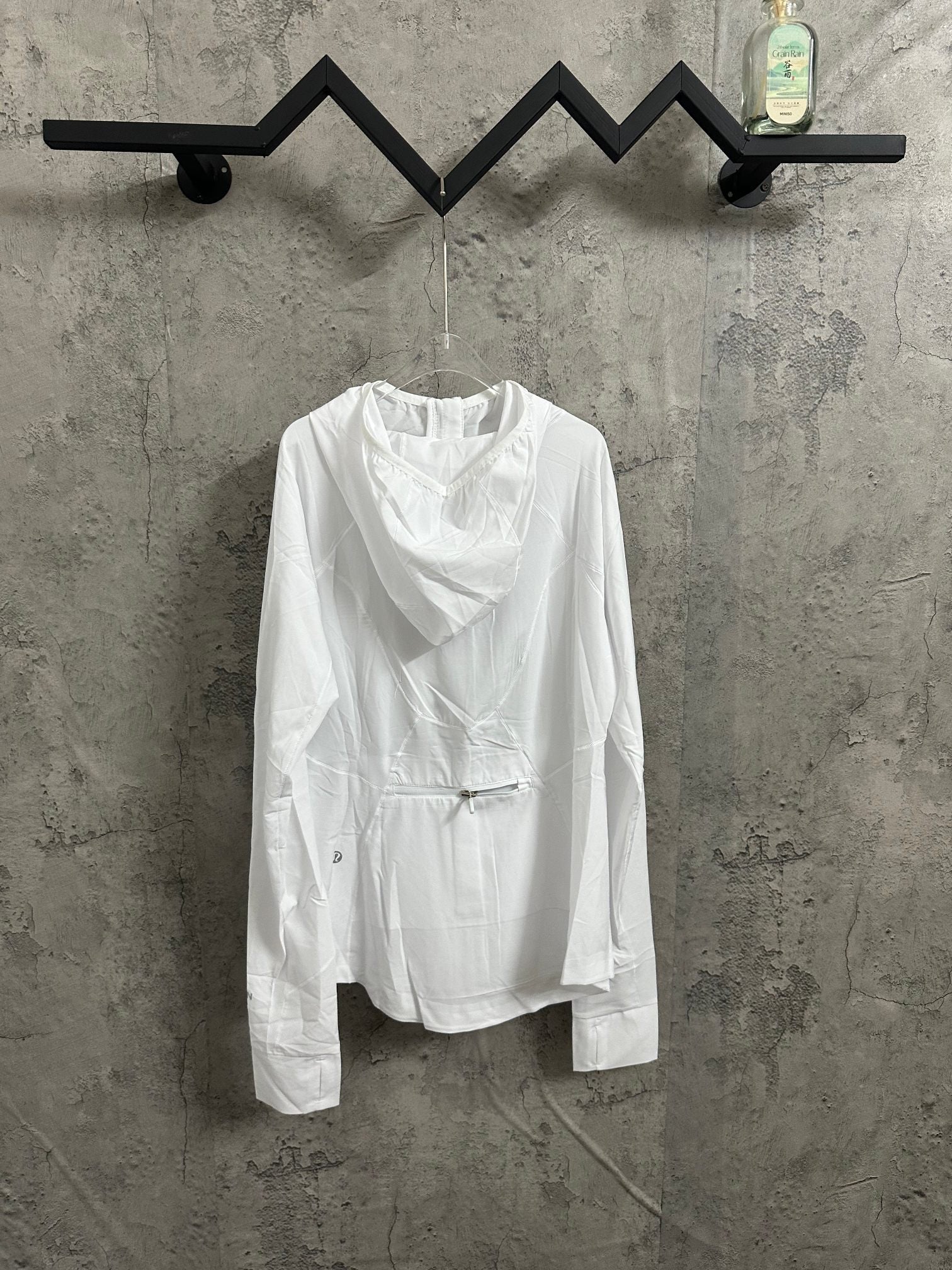 White hooded jacket with full-length front zipper and long sleeves