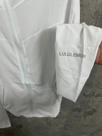 White jacket garment bag labeled LULULEMON