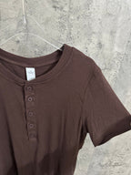 Brown henley T-shirt close-up with round crew neck and button placket