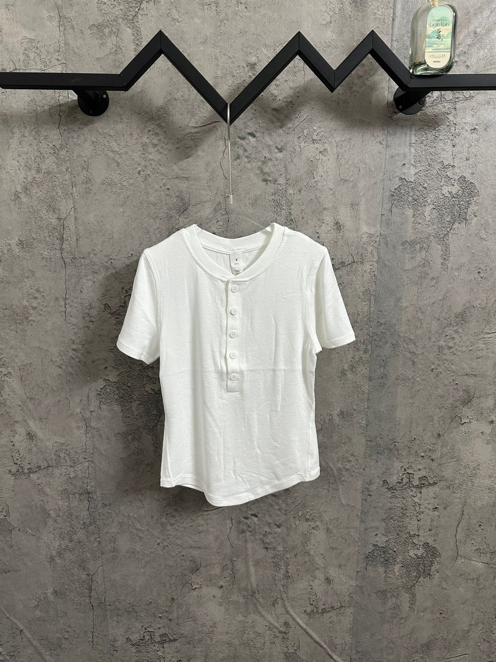 White henley T-shirt with short sleeves and button placket