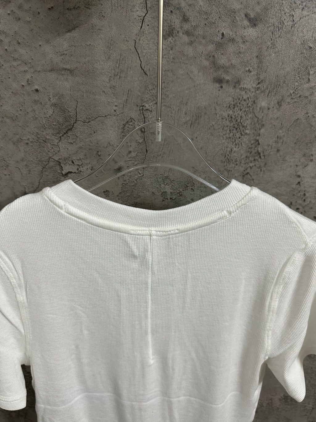 White henley shirt back with yoke seam at upper shoulders