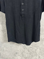 Dark henley shirt front with button placket and rounded neckline
