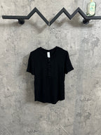 Dark henley shirt with short sleeves and button placket at the front