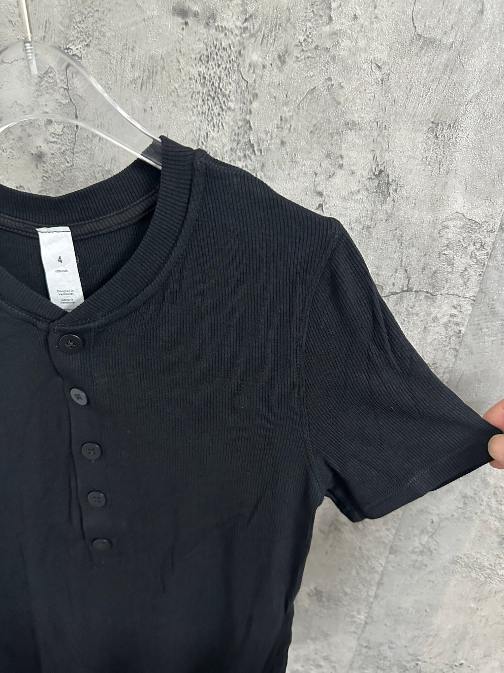 Dark ribbed henley shirt with short sleeves and front button details