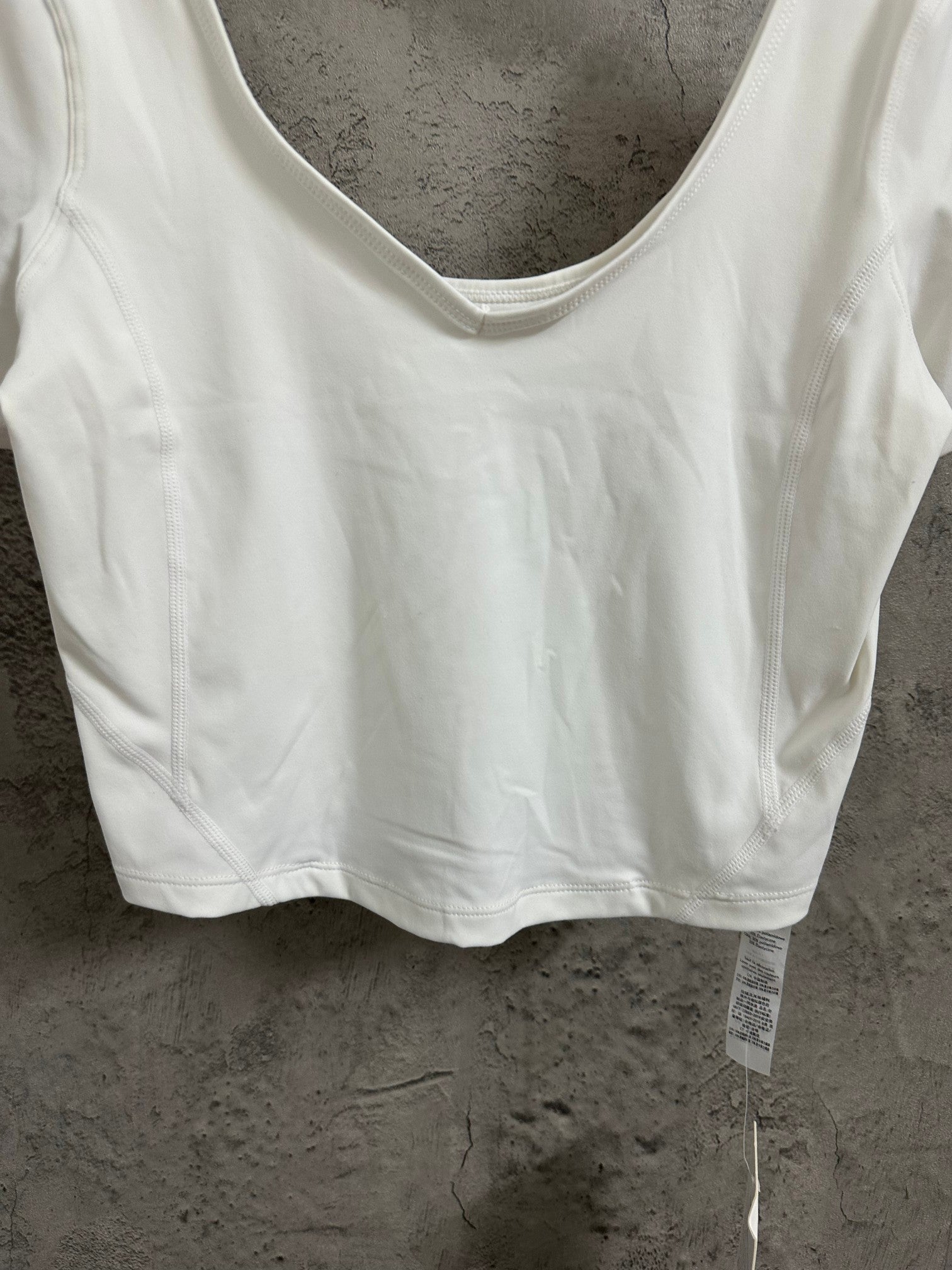 Ralph Lauren white scoop-neck crop T-shirt with visible stitching and short sleeves