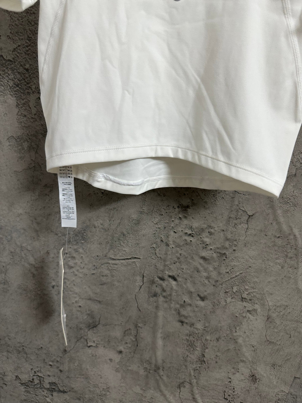 Ralph Lauren white crop T-shirt with curved hem and attached size tag