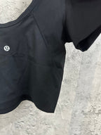 Women’s dark athletic crop top, chest logo detail and scooped neckline