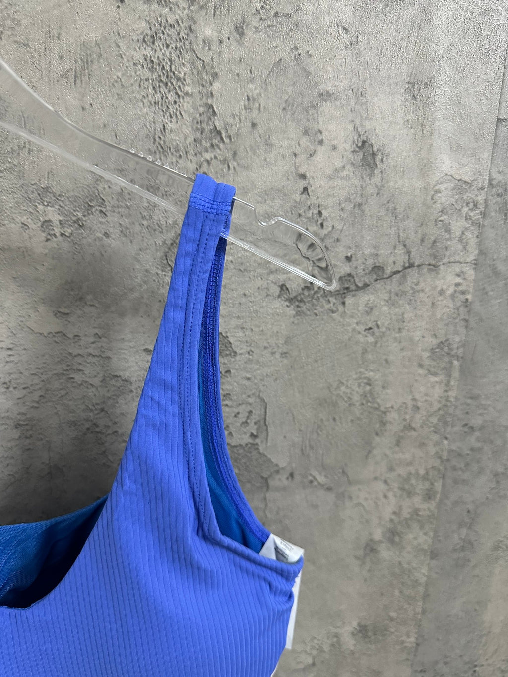 Blue ribbed camisole top with V-back cut and narrow shoulder straps