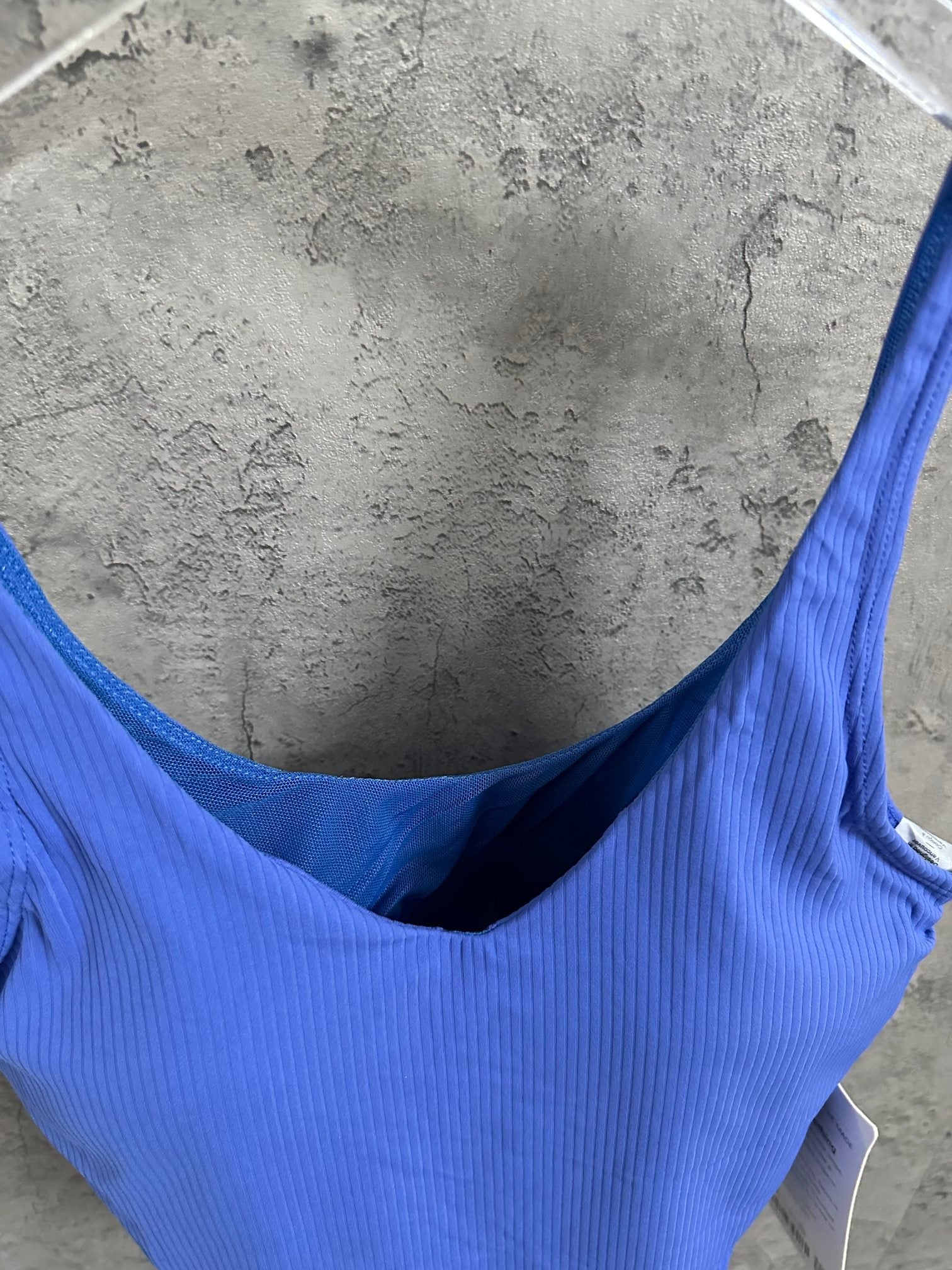 Blue ribbed camisole top with deep scoop back and wide straps