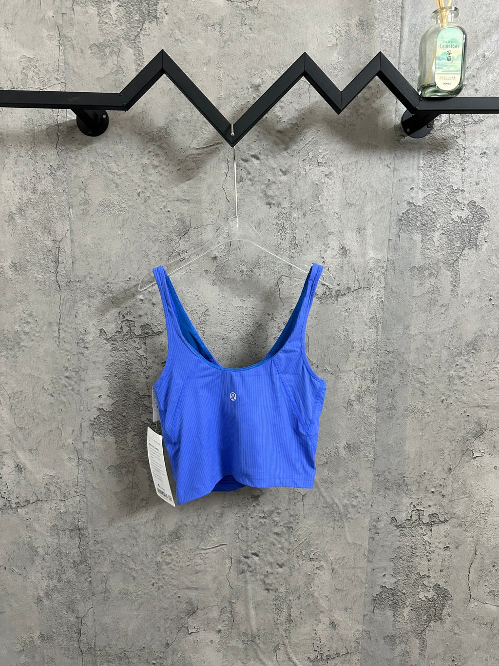 Blue ribbed tank top on hanger, scoop neck and thin adjustable straps