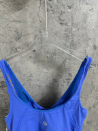 Blue ribbed tank top close-up, scoop back neckline and thin straps