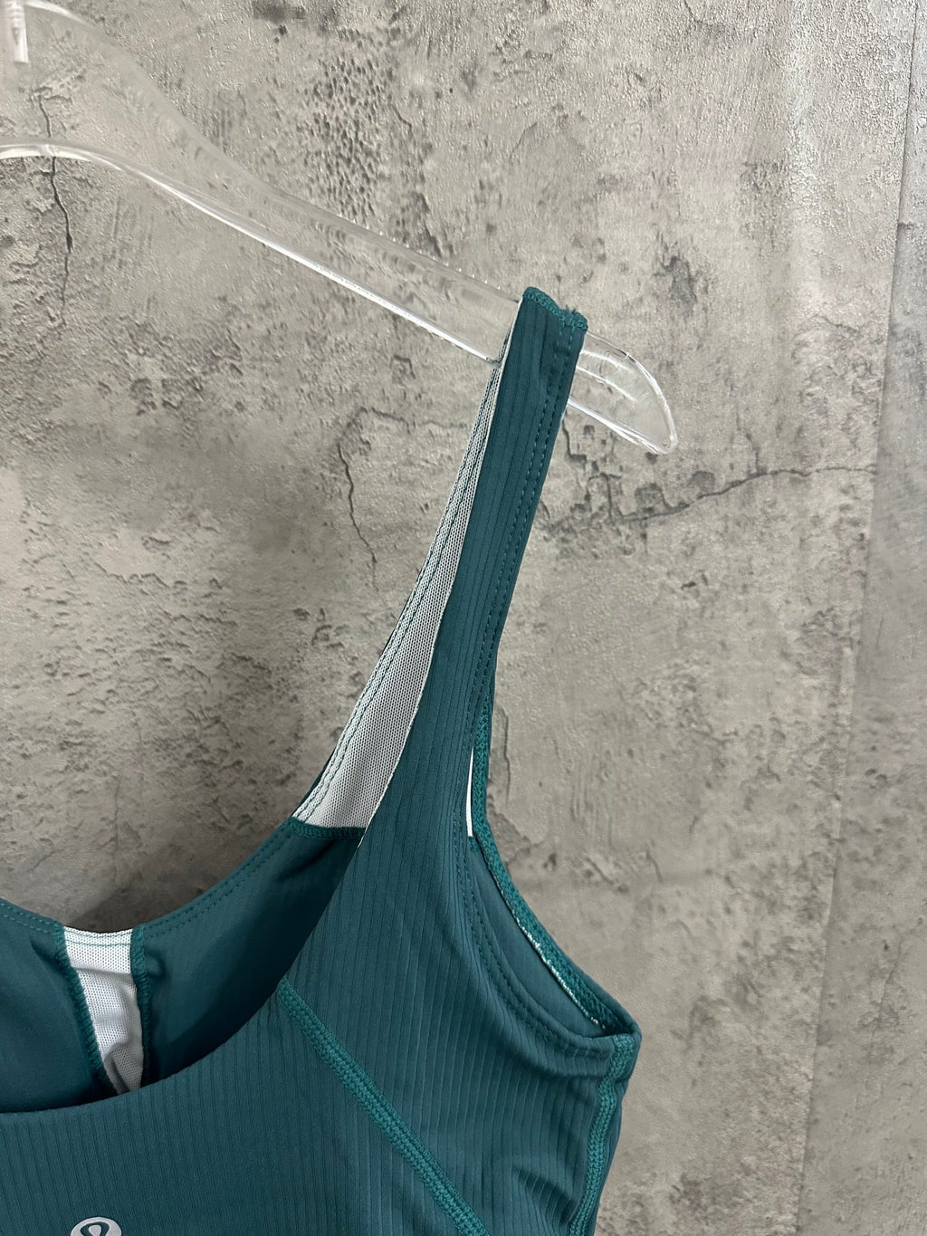Teal bralette with wide straps and scoop neckline, white inner facing