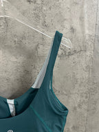 Teal bralette with wide straps and scoop neckline, white inner facing
