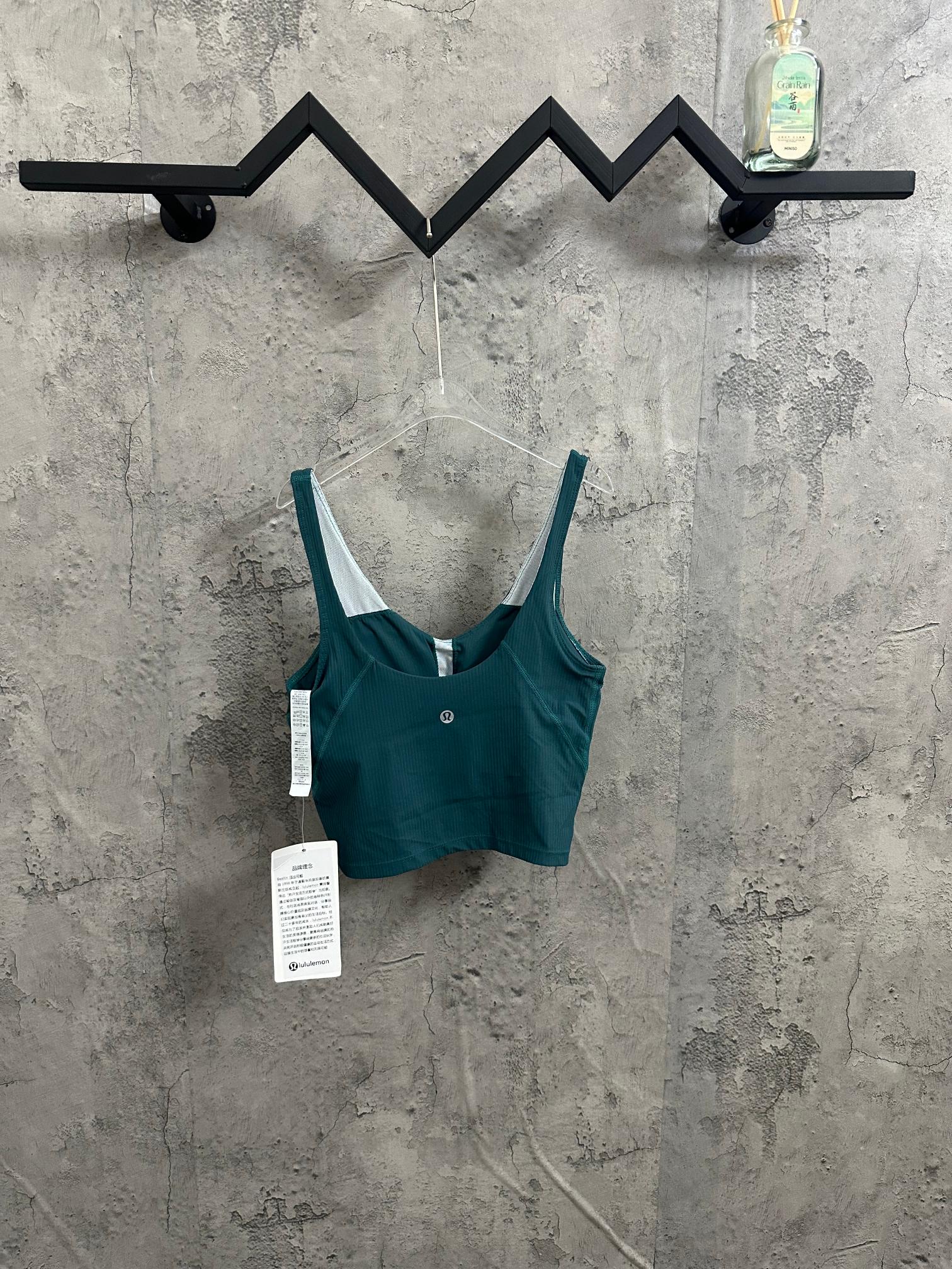 Teal ribbed camisole with V neckline, white-trimmed straps, tags attached
