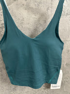 Teal ribbed camisole with V neckline and wide straps; layered hem stitching visible