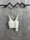 Light cream ribbed camisole with V-neck and adjustable spaghetti straps