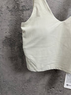 Light cream sleeveless camisole with V-neck and ribbed texture