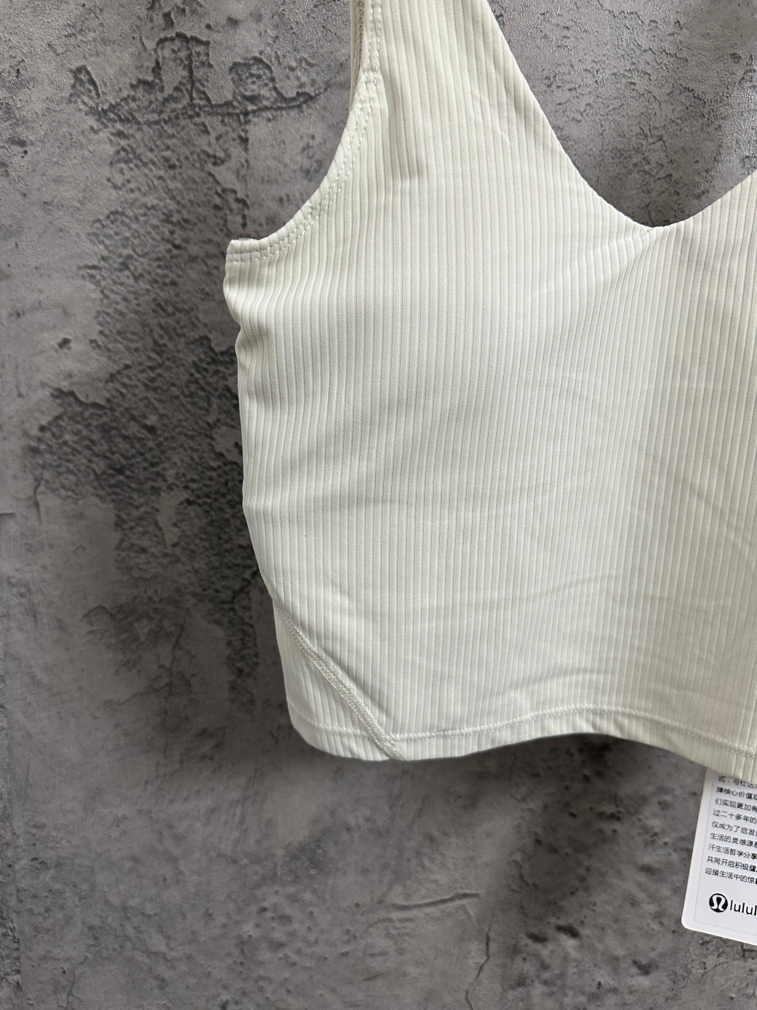 Ribbed camisole with thin straps and fitted silhouette, light cream