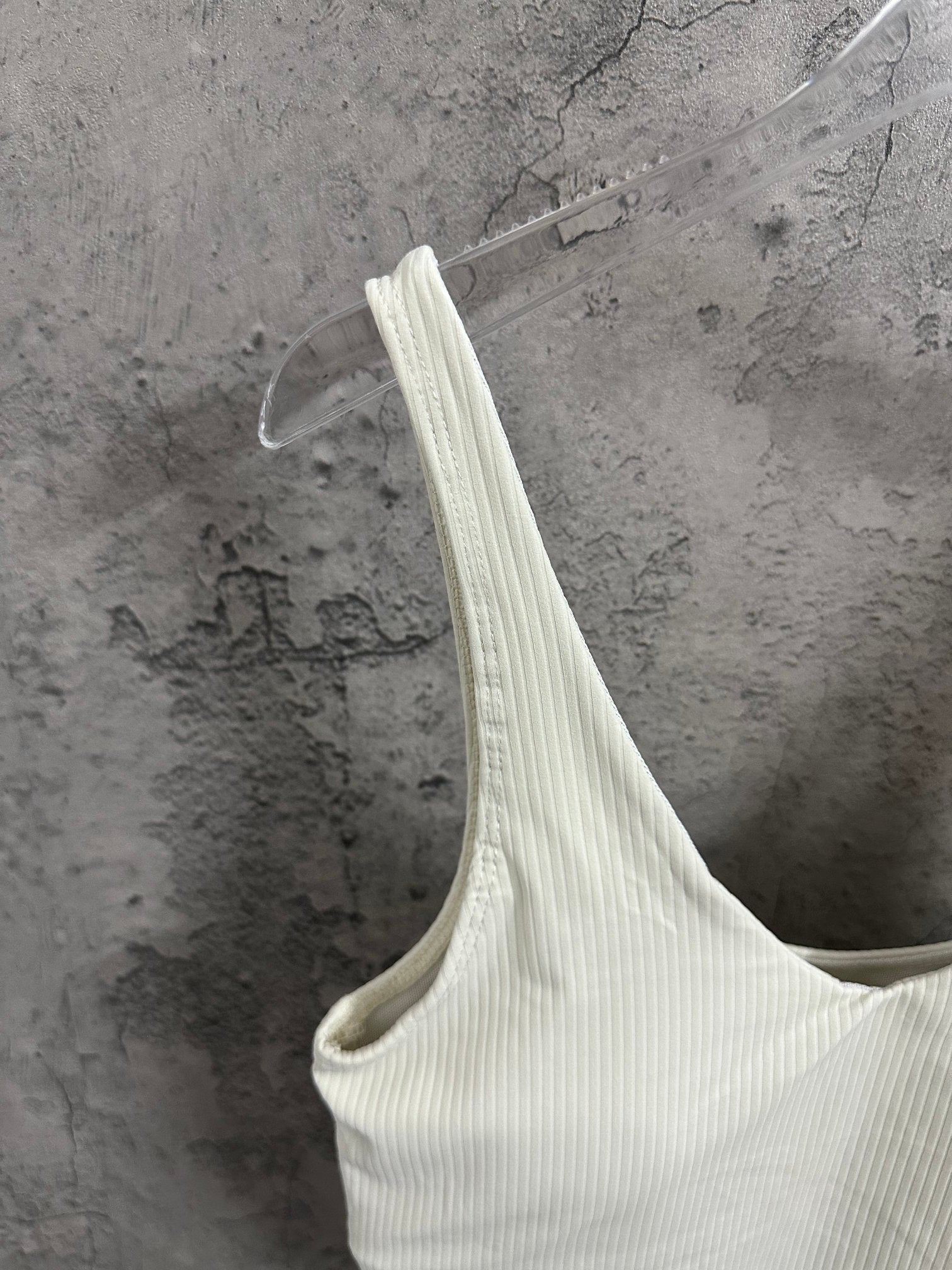 Light cream ribbed camisole with thin straps and V-shaped neckline