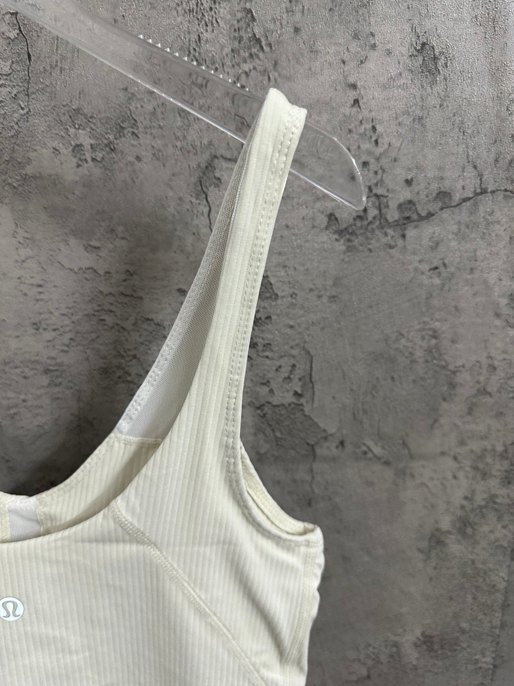 Light cream camisole tank with thin straps and V-neckline