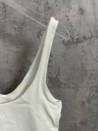 Light cream camisole tank with thin straps and V-neckline