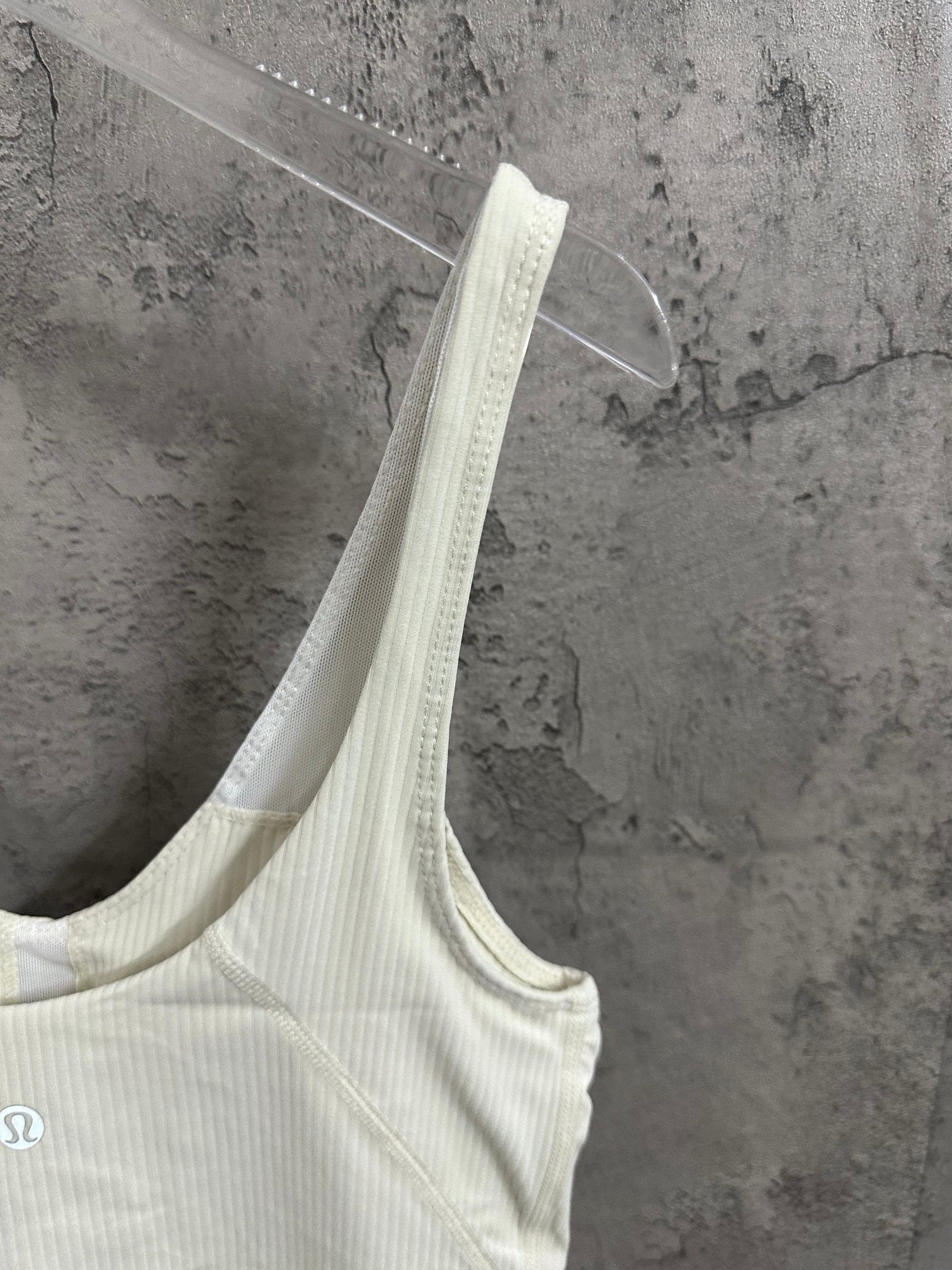 Light cream camisole tank with thin straps and V-neckline