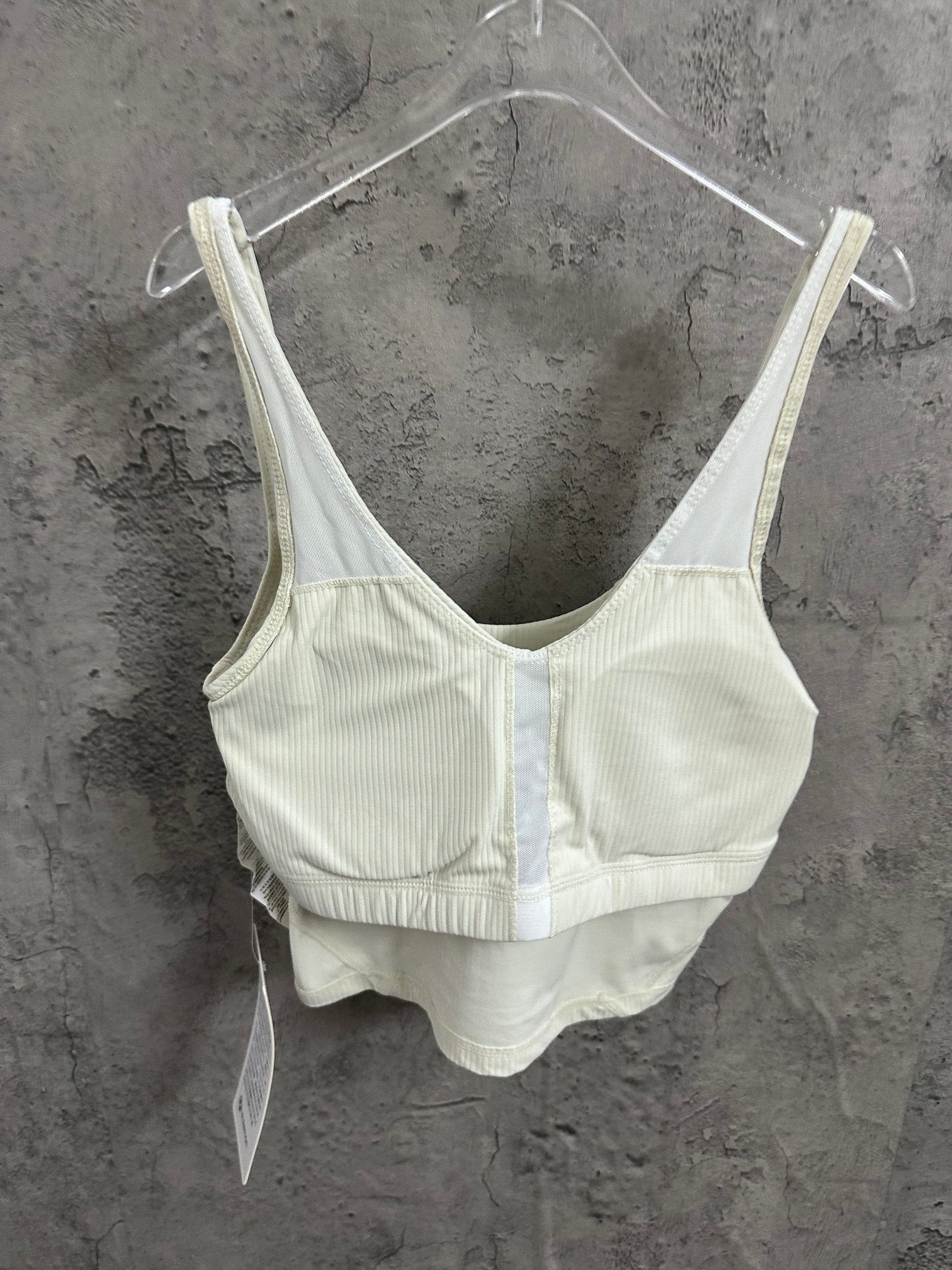 Light cream camisole set with V-neck bralette-style top on hangers