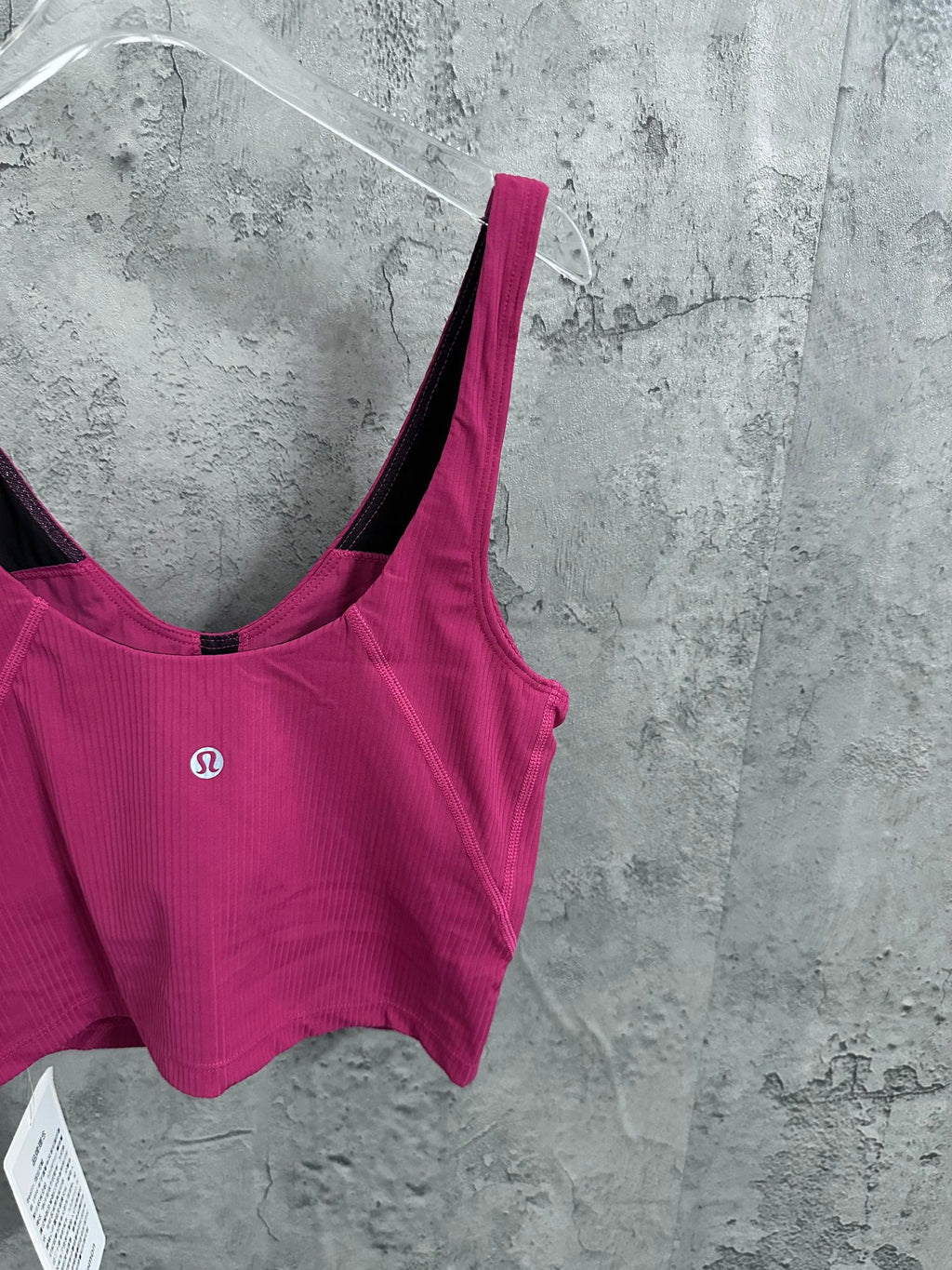 Pink ribbed camisole with scoop back and spaghetti strap, black inner trim