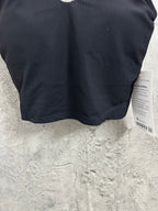 Black ribbed sports bra back hem with small label and rounded bottom