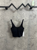Black ribbed sports bra with wide straps and scoop neckline