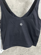 Black ribbed sports bra front view with small chest logo patch