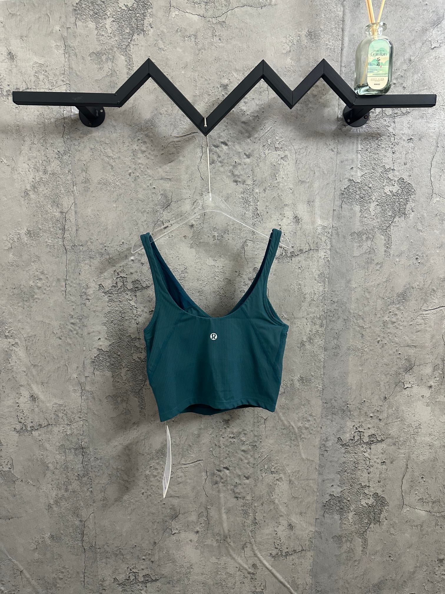 Teal ribbed tank top with wide straps, scoop neck, small chest logo