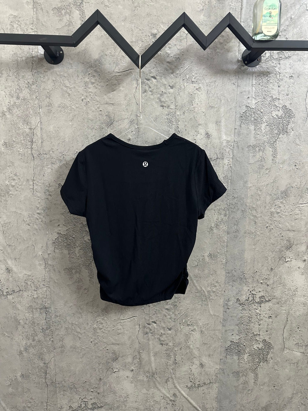 Dark short-sleeve crewneck T-shirt with small chest logo