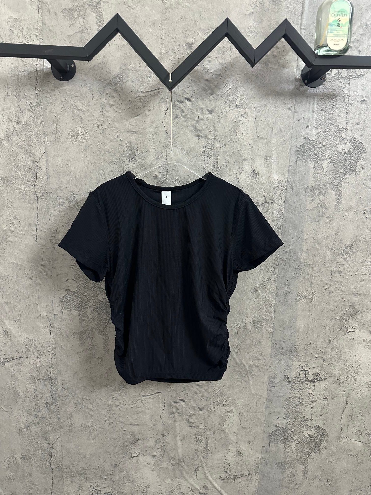Dark navy short-sleeve crewneck T-shirt on hanger