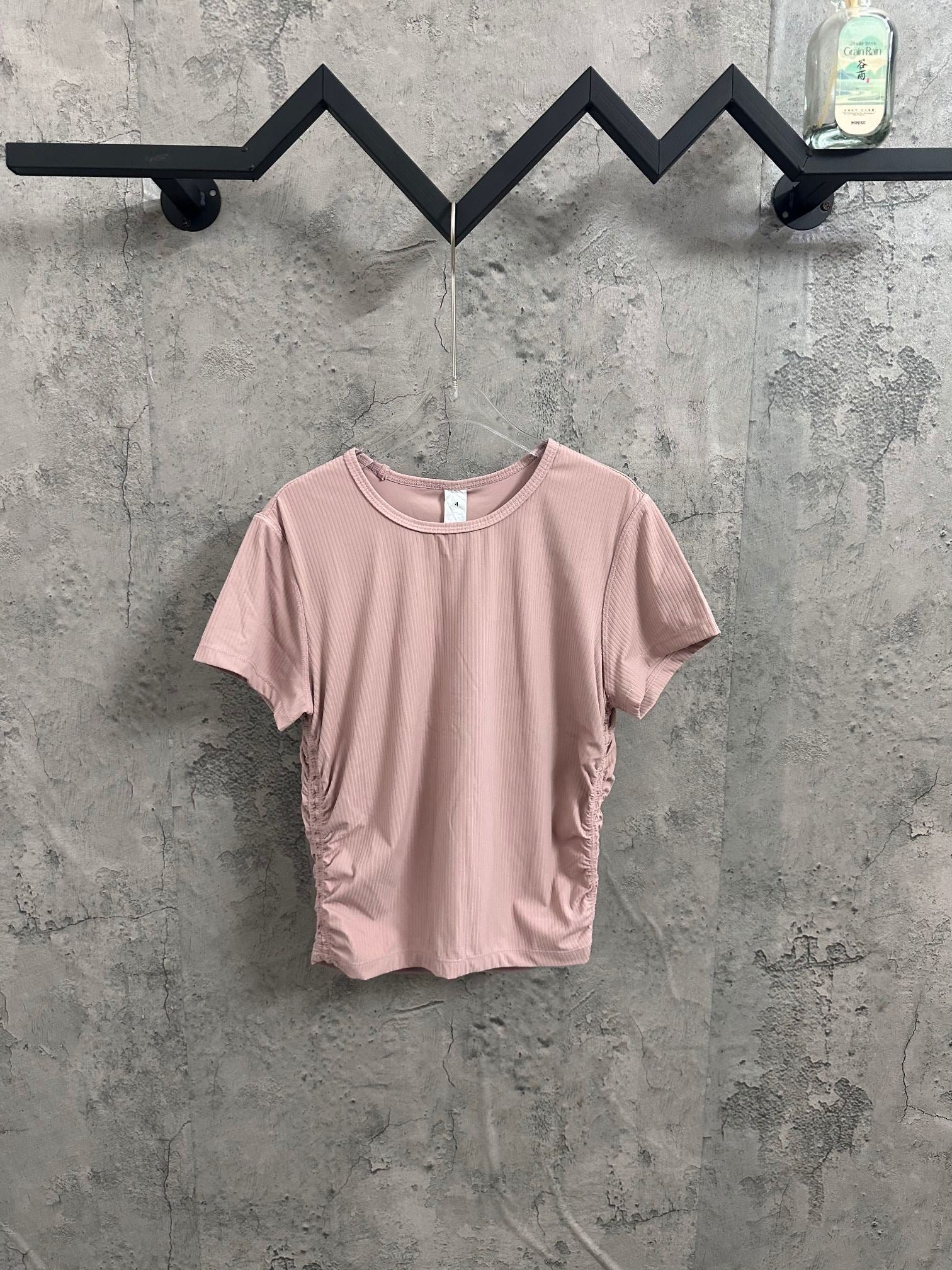 Light pink ribbed crew-neck T-shirt on hanger