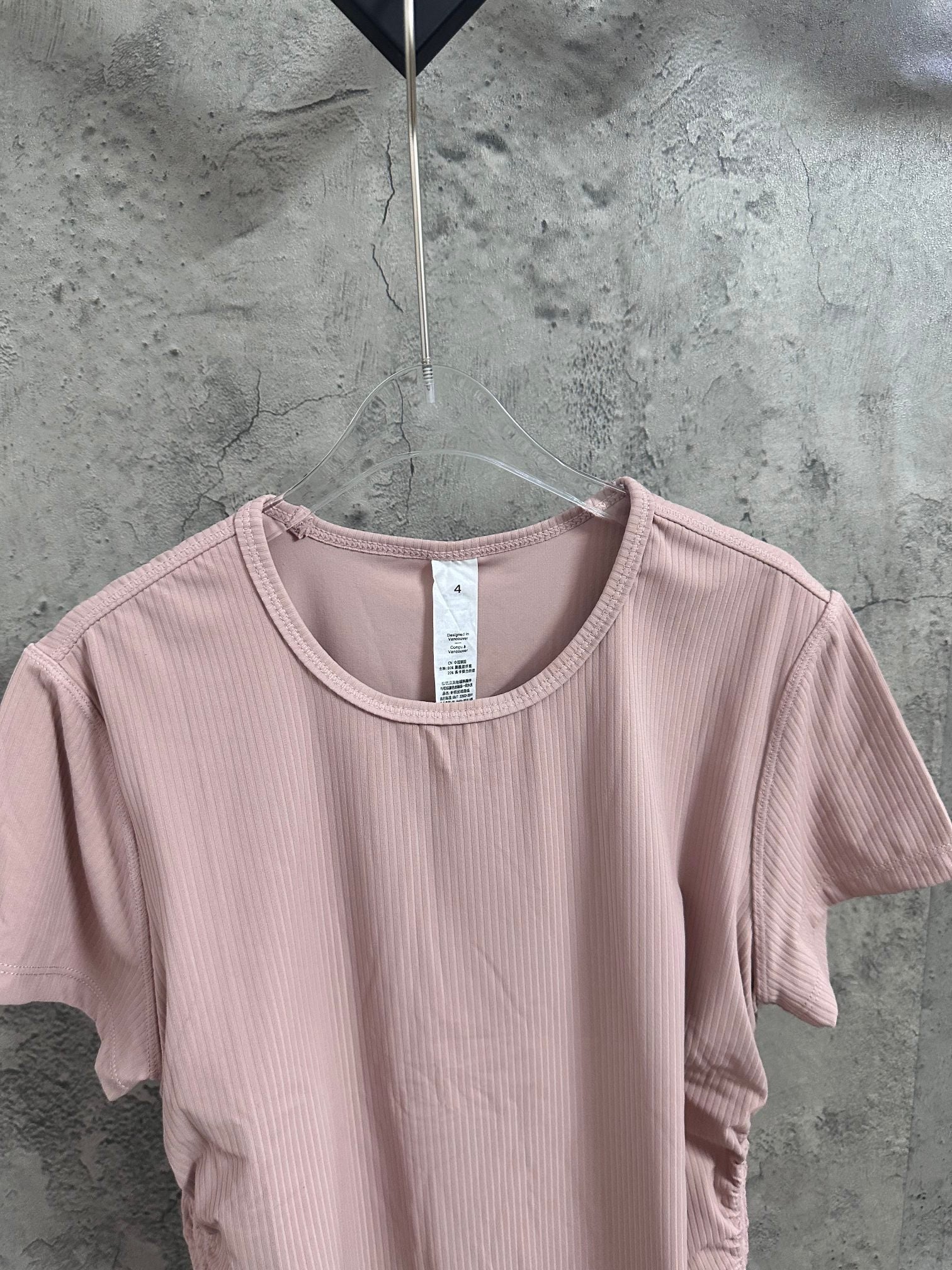 Light pink ribbed crew-neck T-shirt neckline detail