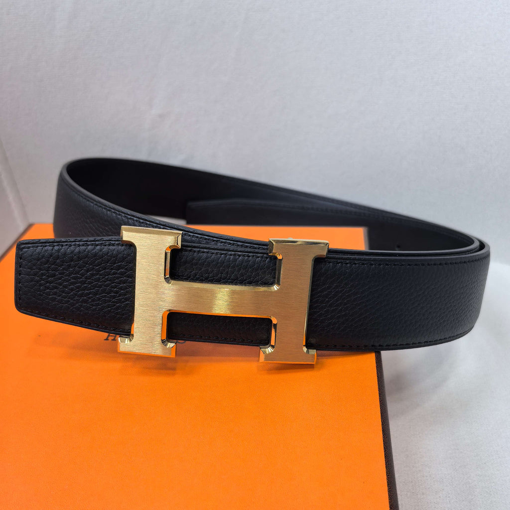 Hermes belt side view, black leather with gold-tone H buckle
