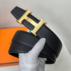 Hermes belt, black textured leather, gold-tone H buckle centerpiece