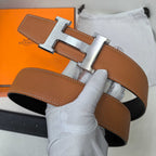 Hermes leather belt with silver-tone buckle, tan-brown strap and stitched edges