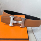 Hermes leather belt with silver-tone buckle on tan-brown strap, stitched edge finish